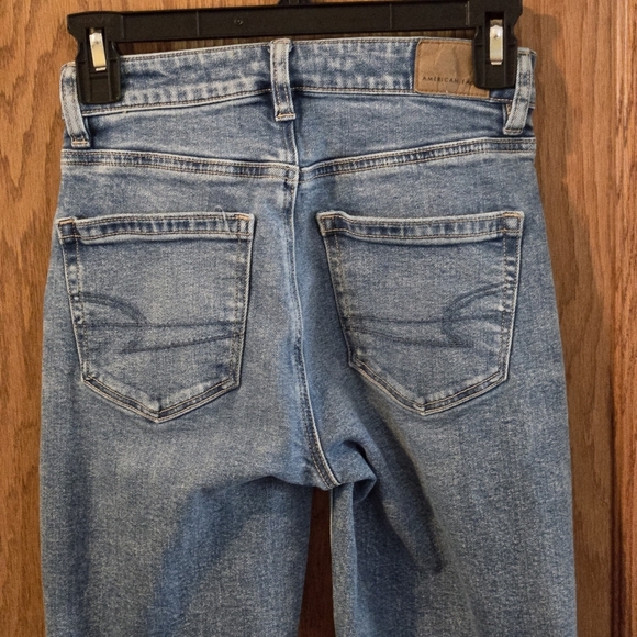 American Eagle Strigid Mid Rise Distressed Jeans 000 Regular Tapered Leg Ripped - Picture 4 of 11